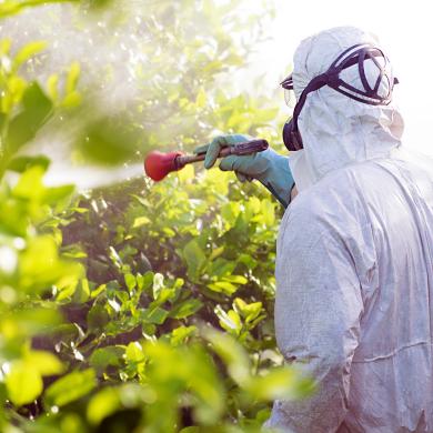 Man spraying generic biopesticide.