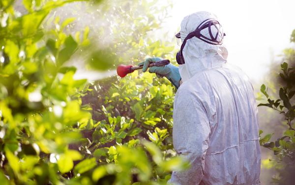 Man spraying generic biopesticide.