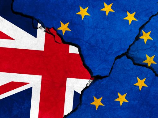 GB & EU flags on cracked concrete.