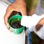 Man pouring and mixing fungicidal plant protection product.